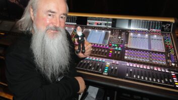 U2's sound director, Joe O'Herlihy, with his DiGiCo SD7 console and a mini doppelganger: “There’s a guy on the crew here that makes them; it’s pretty cool, alright!”