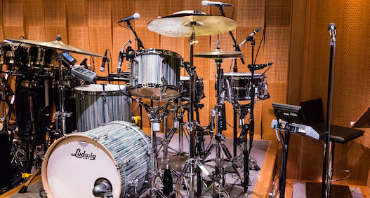 A plethora of Shure mics surround Questlove’s drums on the set of the Tonight Show, with Black Thought’s KSM9HS vocal mic nearby.