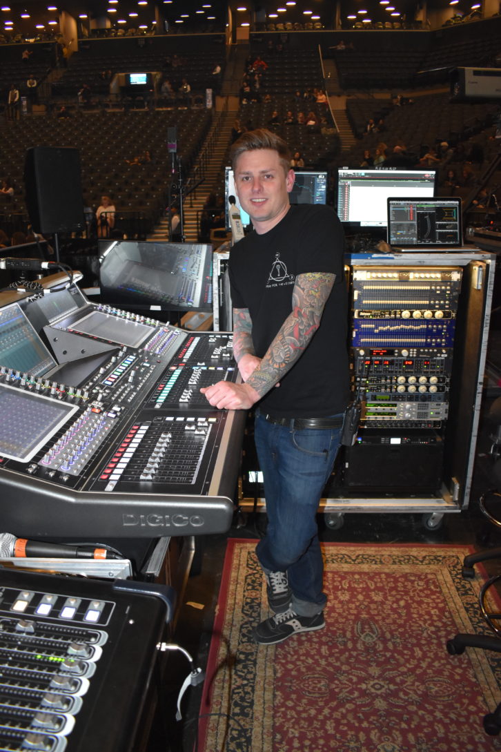 Engineer Spencer Jones pauses with his DiGiCo SD5 at the FOH position inside Brooklyn’s Barclays Center.