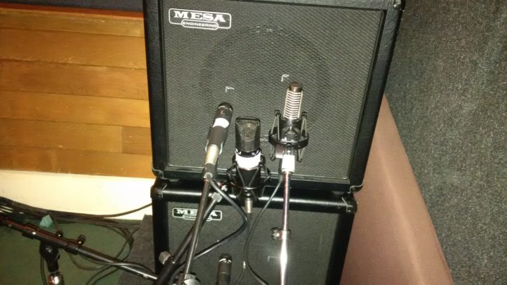 A pair of Petrucci’s Mesa 1x12 speaker cabinets, packed inside Chycki’s “guitar condom” isolation, miked with a combination of a Royer 121, a Mojave FET 301 and a Shure SM57, placed at the center of the cone for additional brightness.