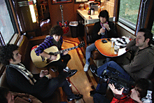 On the bus (clockwise from left): Kevin, Nick and Joe Jonas, producer John Fields, cameraman Mark Sarner. Photo: Rob Hoffman