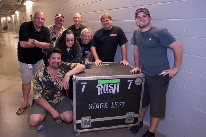 Keeping the Time Machine tour running like clockwork are (front row, l-r): Brent Carpenter, monitor engineer; Geddy Lee, bass/vocals; Alex Lifeson, guitar/vocals; Chance Stahlhut, system engineer; Anson Moore, monitor system tech. (Back row, l-r): Liam Birt, tour manager; Brad Madix, FOH engineer; Craig Blazier, production manager.