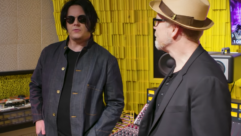 Rock star Jack White (left) and TV host Adam Savage discuss the magic of vinyl records inside Third Man Records' Detroit facility.