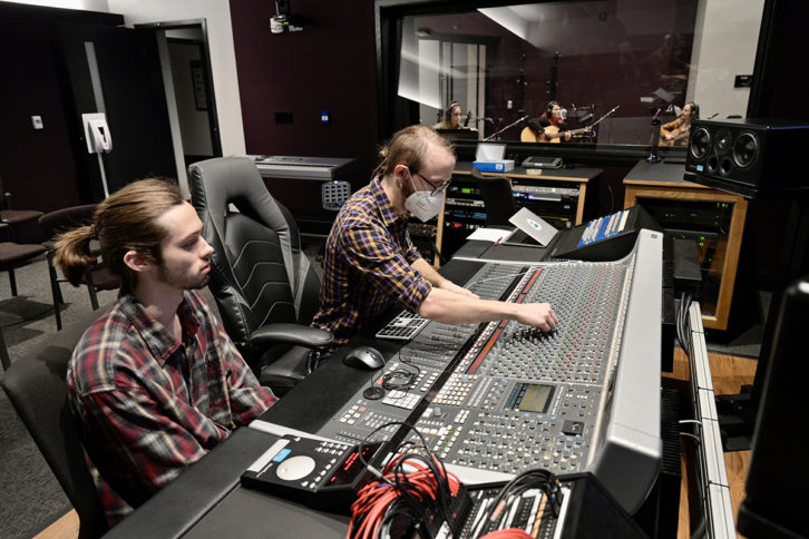 Fox DeVaughn, left, of Tupelo, Miss., a Master of Fine Arts in Recording Arts and Technologies student in Middle Tennessee State University's Department of Recording Industry, listens as fellow MFA student Nate Stoll of Portland, Oregon, checks the levels.