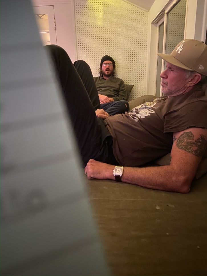 John Frusciante, on the couch, and Chad Smith taking a break. Photo: Ryan Hewitt.