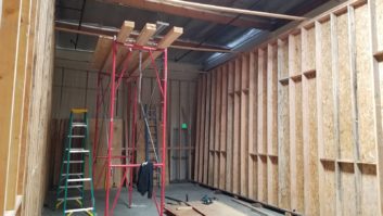 The outer room side walls raised and in position on the sleepers, waiting for the outer layers of drywall. paul massey mix room