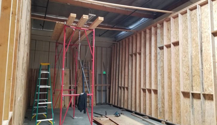 The outer room side walls raised and in position on the sleepers, waiting for the outer layers of drywall. paul massey mix room