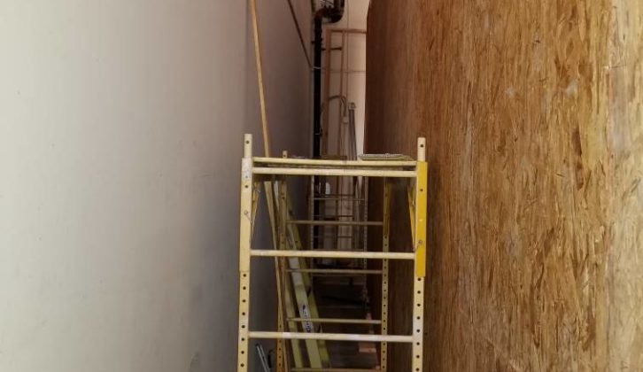 The open workspace between raised outer wall and the industrial unit’s existing wall. paul massey mix room