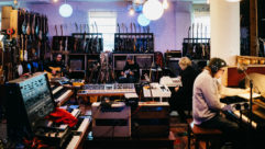 At their stations in The Loft are (L-R): Jeff Tweedy, Nels Cline, Pat Sansone and Mikael Jorgensen. At the far left, engineer Tom Schick’s silhouette can be seen in the “control room.” PHOTO: Jamie Kelter Davis