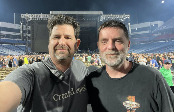 Front-of-House engineers Brent Carpenter (Mötley Crüe, left) and Ronan McHugh (Def Leppard) mark another night’s work done as the audience shuffles out of Buffalo, NY’s Highmark Stadium.