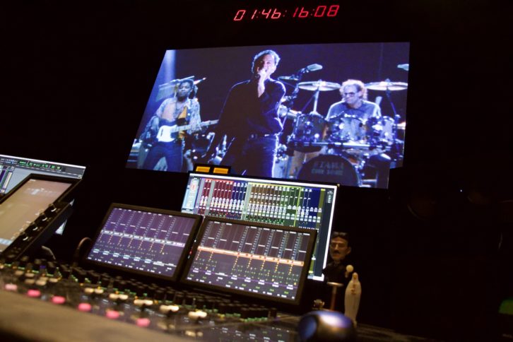 The Avid S6 display module showing panning information for the Dolby Atmos mix. Just behind it is the Mix Window, highlighting various instrument track groups, with Billy Joel in 4K on the projector perf-screen. PHOTO: Kim Farrell