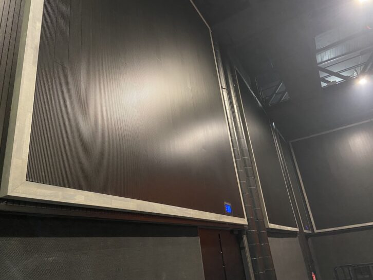 Acoustic panels line the perimeter of the room