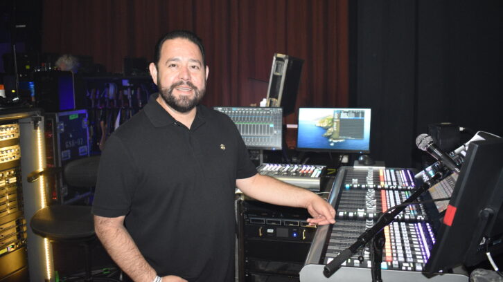 Monitor engineer Ramon Morales at his  Solid State Logic Live L650 mixing console.