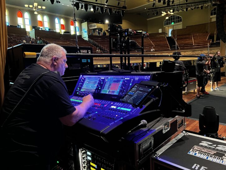 At the Ryman in Nashville, monitor engineer Colten Hyten checks out his Allen & Heath dLive S5000 surface at stageside.