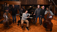 Pictured in United Studio A is pianist and composer Clifford Lamb seated at the Steinway grand piano Clifford Lamb, and standing (L-R) are Henry Franklin, bass; Michael Clark, score supervisor and associate producer; Herlin Riley, drums; Jeffrey Weber, producer; Clark Germain, recording engineer/mixer; and Edwin Livingston, bass. Photo by David Goggin.