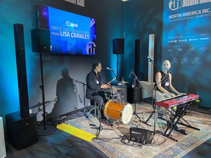 New Zealand songstress Lisa Crawley, seen using the new LD Systems MAUI 11 G3 W portable cardioid column PA system at the recent NAMM Show in Anaheim, CA.