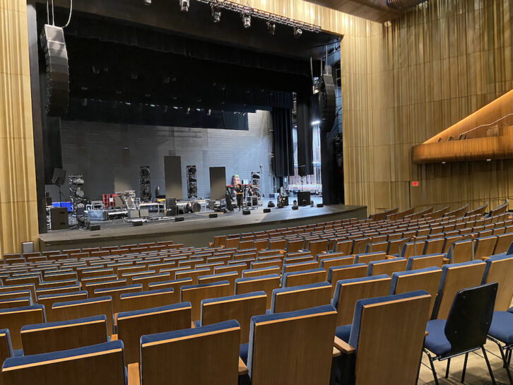 The interior of Capital One Hall. The gold-colored panels lining the walls are perforated metal under which are laid acoustic absorption and diffusion materials.