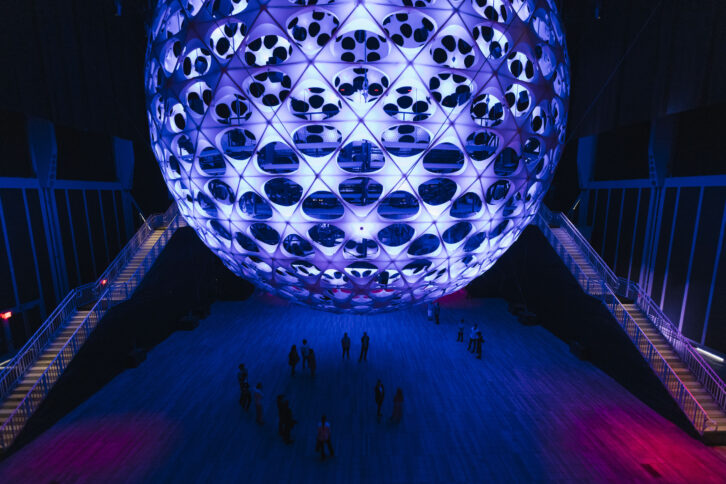 Visitors approach the Sonic Sphere, suspended inside NYC's The Shed. PHOTO: Ahad Subzwari.