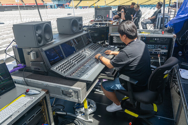 Blackpink FOH engineer Young-Il Kim at the Avid S6L-32D during soundcheck at Dodger Stadium. Inset: The analog rack, with signal converted through a pair of RME M-32 Pros. Photo: Steve Harvey.