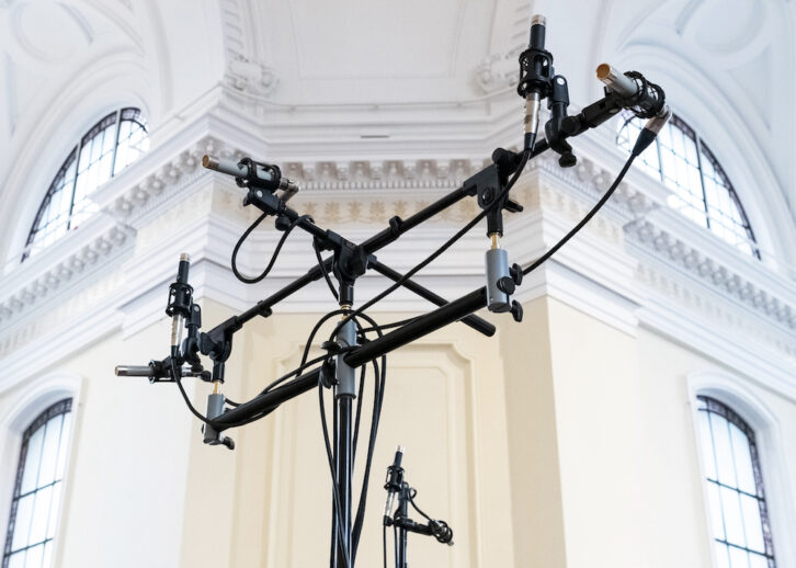 Seven primary microphones correspond to each of the monitors in a 7.1 configuration, with the “Metcalfe Tree” up front; meanwhile, producer/ engineer Scott Metcalfe adjusts a pair of Telefunken TF51s.