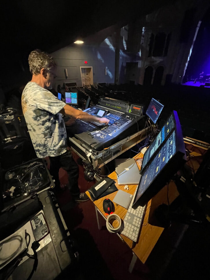 Mixing the old and new, FOH engineer George Cowan oversees a vintage Yamaha DM2000 digital mixer tied into a trio of UA Apollos and a plethora of plug-ins. Photo: Dave Cook.
