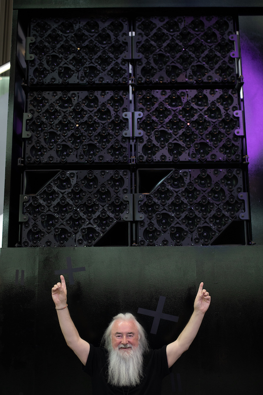 U2 front-of-house engineer Joe O-Herlihy, in front of one of the main Holoplot X1 matrix arrays behind the stage at Sphere. Photo: Ross Andrew Stewart 