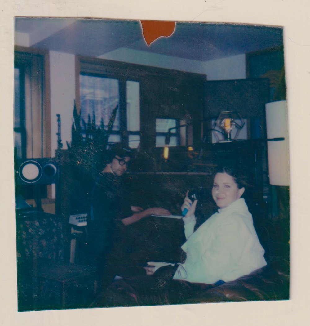 Antonoff, who is rumored to have a fondness for Polaroids, at his home piano while Lana Del Rey looks on. 