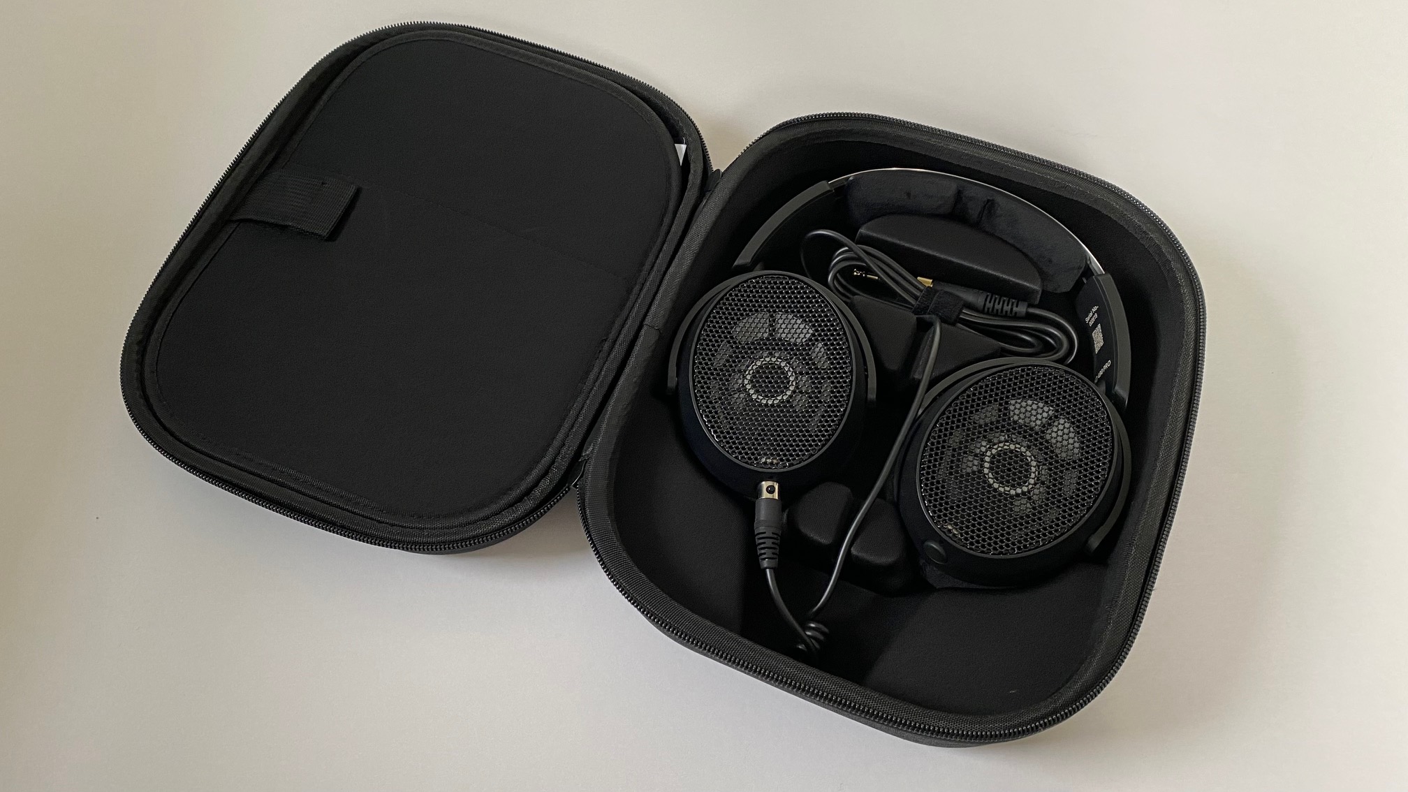 The 'Plus' edition of the Sennheiser HD 490 Pro Headphones come with accessories including a case, second cable, and a second headband cushion.