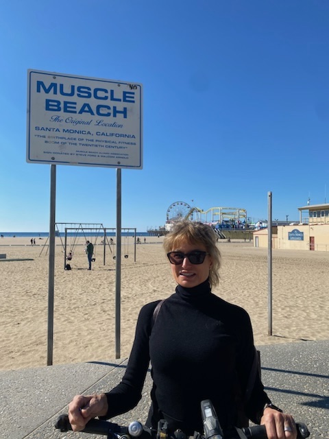Betty Bennett, Apogee Owner CEO, on her bicycle along the Santa Monica Beach.