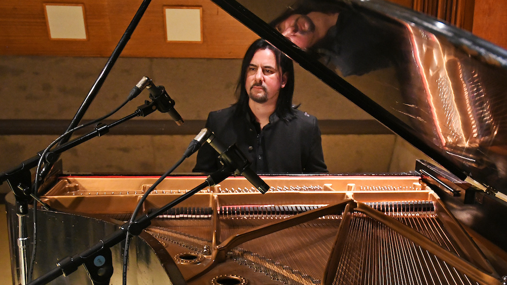Pictured at the Steinway grand piano at EastWest Studios in Hollywood is Leo Z with his matched pair of Telefunken ELA M 260 microphones. Photo by David Goggin.