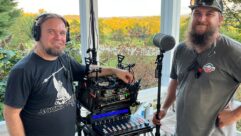 (L-R) Alex Haralson and boom operator Jerry Sebastian, standing at the mix cart on the set of the short film Secret City.