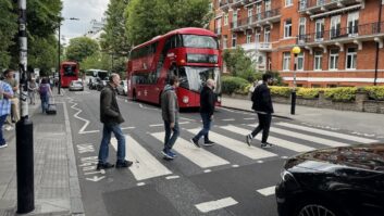 A stroll through Abbey Road. Watch out for that bus! Photo: Phil Castellano. [Editor's Note: Steve is last in line.]