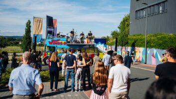 Drunkin’ Grownups—Adam Hall Group’s in-house employee band—tear it up atop the 1972 Wings Tour Bus.