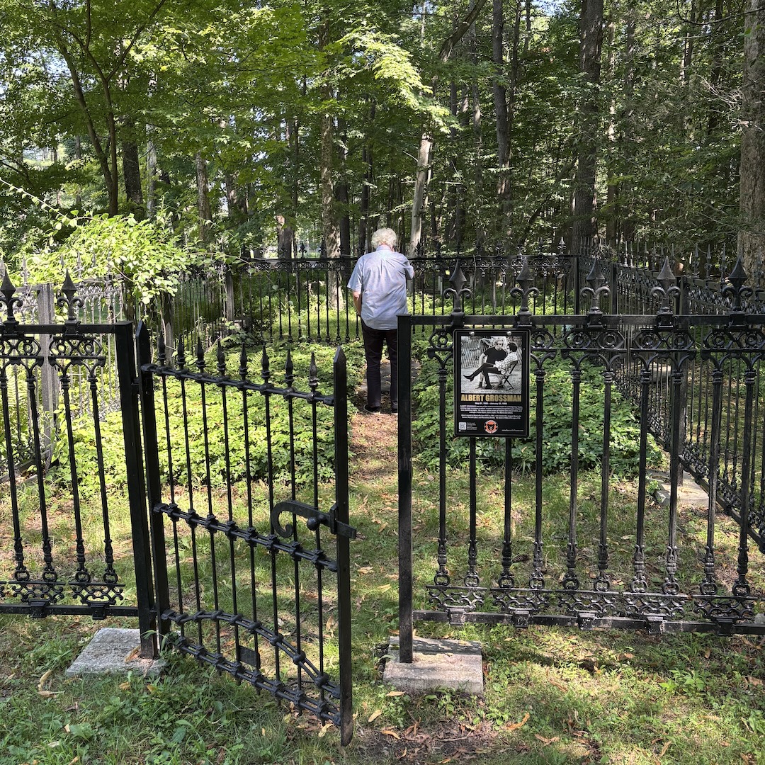 John Storyk, unaware that I’m taking a picture, visits Albert Grossman’s gravesite behind Bearsville Theater for the first time in a decade. He was one of the insiders who arranged for the burial to be held onsite when Grossman passed away in 1986. Photo: Tom Kenny.