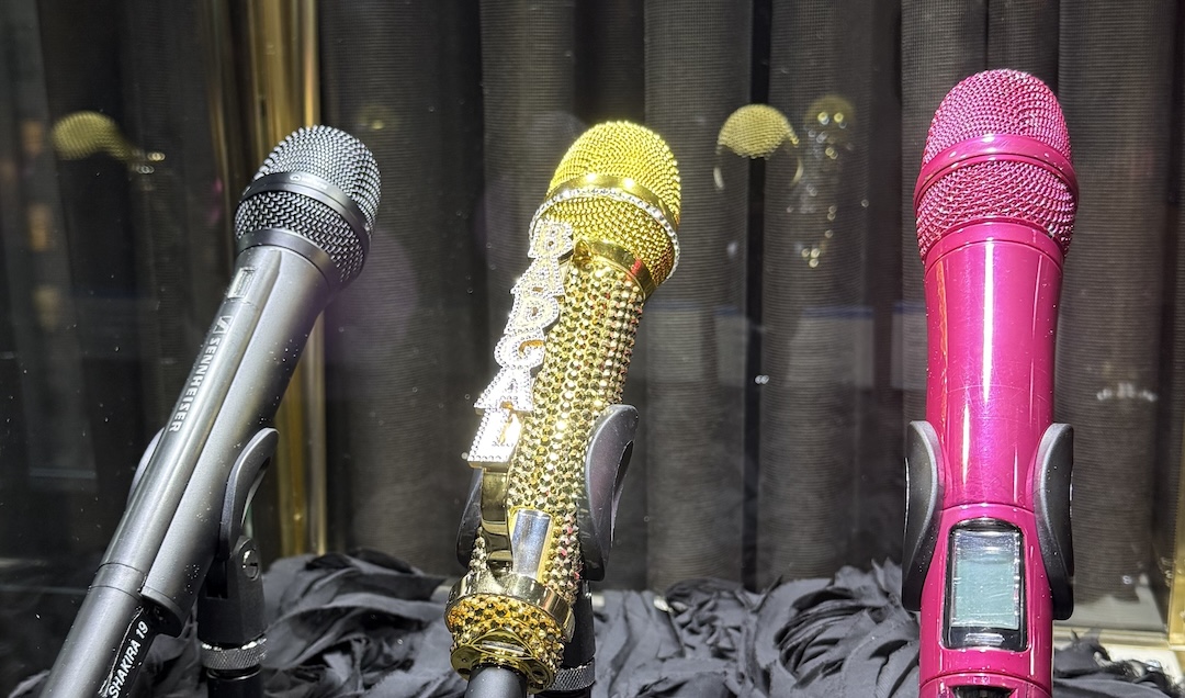 Nearby sat Shakira’s circa-2006 SKM 5200 handheld, Rihanna’s circa-2009 SKM 5200 24k gold Swarovski Dorado from 2009 with custom “BADGAL” knuckle-duster), and Miranda Lambert’s blazing pink SKM 2000 with a MMD 935 capsule from 2012, used when she sang “America The Beautiful” at Super Bowl XLV1.