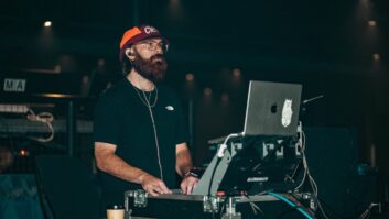 Brent Washburn mans his Allen & Heath dLive C1500 control surface on the road with artist Elijah Woods.