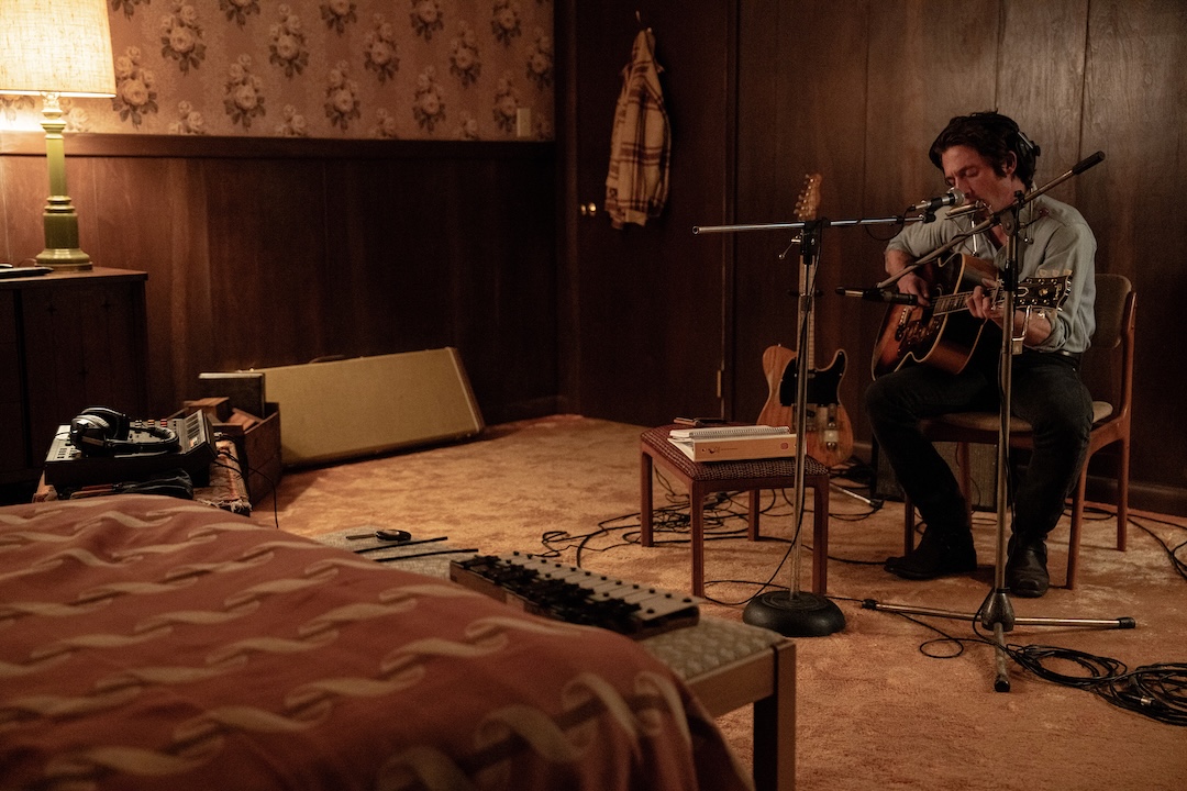 Jeremy Allen White on the Colts Neck bedroom set, showing the recreated recording setup Batlan had created for Springsteen, with the TEAC 144 set up next to him on a small table. Photo: Macall Polay/20th Century Studio