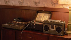 On-set recreation of the mixing setup at Colts Neck: the TEAC 144 4-track Portastudio, an Echoplex Maestro 3, and a 1980 Panasonic RX-5100 boom box. Photo: Macall Polay/20th Century Studio