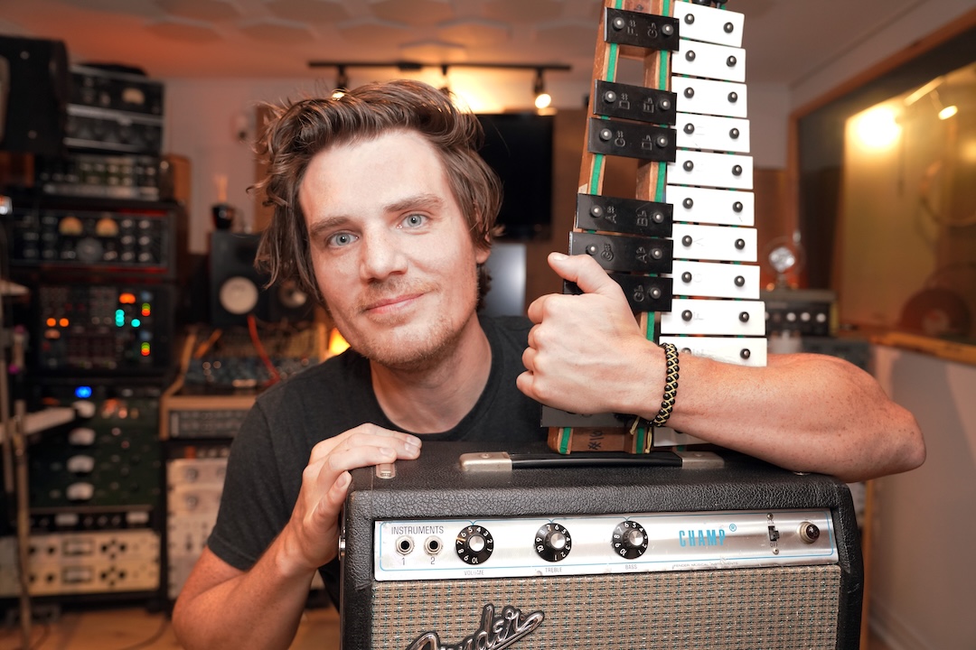 Music gear consultant Joshua Lutz with the glockenspiel and Fender Champ he provided for the Colts Neck bedroom set, as seen in his JML Studios. Photo: Joshua Lutz
