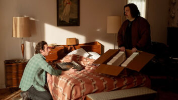 Actors Jeremy Allen White and Paul Walter Hauser (portraying Mike Batlan) unpack the “new” TEAC 144 and give it a look. Note the Portastudio’s packaging recreation, including custom-formed Styrofoam inserts. Photo: Macall Polay/20th Century Studio