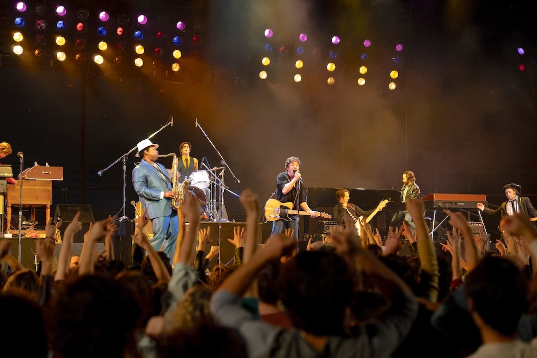The cast recreating Springsteen’s 1981 performance at Riverfront Coliseum, filmed at the former Izod Center in Meadowlands. Photo: Macall Polay/20th Century Studio.