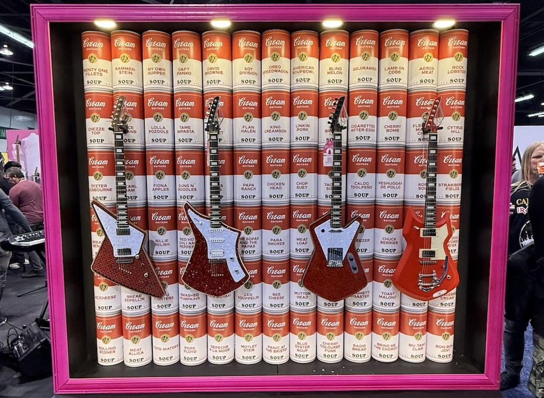 You can't go to NAMM without walking through the guitar section, admiring the creativity and ingenuity of today's builders—and that's just over their booths, like this one, created by Cream Guitars. Some of those soup can titles are a riot.