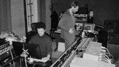 Blue May stands in front of the 1970s API 48-Channel Split record/ monitor console inside London’s RAK Studio 1 during a string session with engineer Ben Baptie seated at the Pro Tools station. Photo: Courtesy of Blue May.
