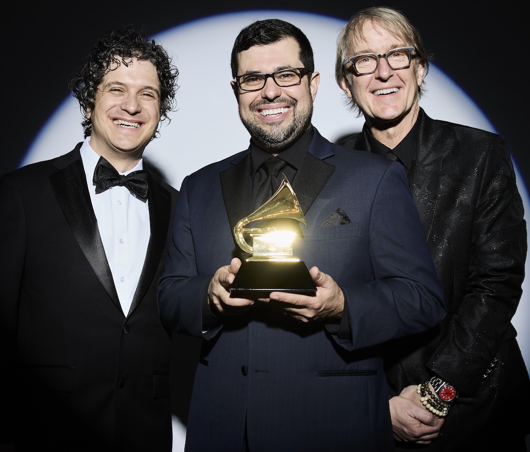 Gray celebrates his 2026 Grammy Award for Best Immersive Audio Album with musician/arranger Drew Jurecka, left, and mastering engineer Michael Romanowski. Photo: Courtesy of Justin Gray.