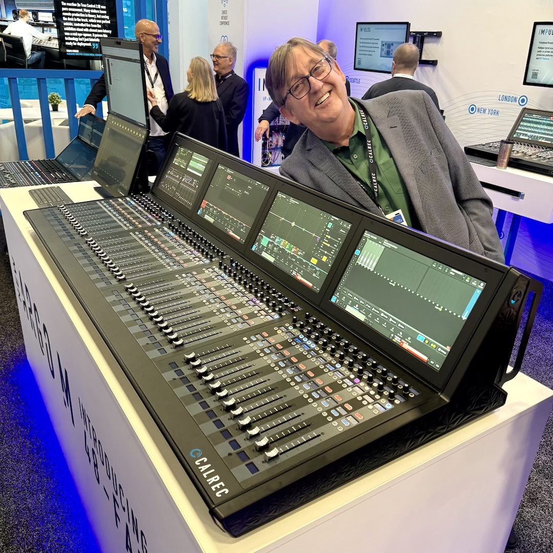 Calrec’s Dave Lewty grins as he shows off the company’s Argo M scalable IP-native audio console, offering seamless ST2110 integration and intuitive touchscreen control. The Argo M is available in 24, 36 or, as seen here, 48-fader footprints.