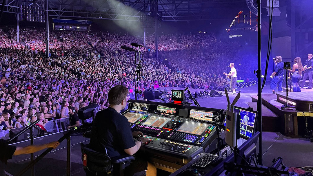 Monitor engineer Rob Brazinski at his DiGiCo Quantum7 at stageside.