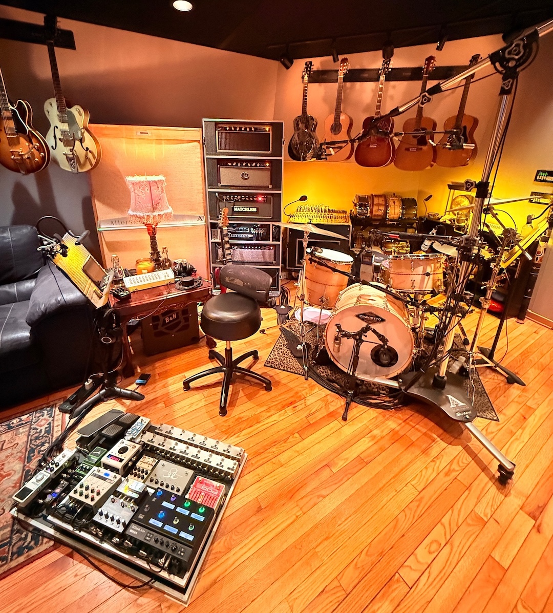 House private reserve Craviotto drum kit, with a vintage Trident TSM console in the back corner, surrounded by shelves of percussion. Photo: David Kalmusky.