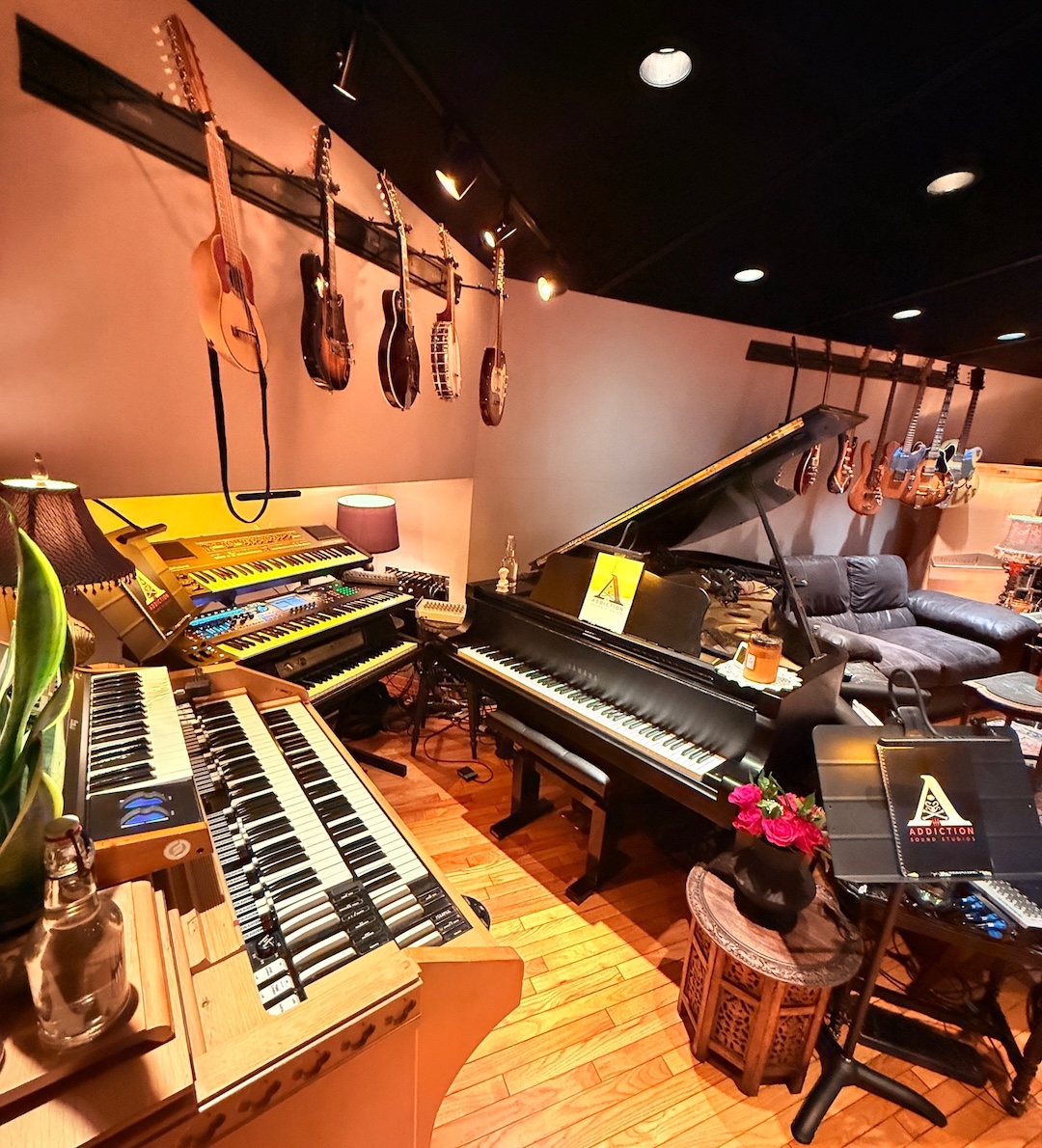 The piano and keyboards section, including a 7-foot Yamaha C7 grand with MIDI, Moog Little Phatty, Hammond C3, Juno 106S, Yamaha Montage M7, Wurlitzer 200A and a Roli MPE Keypad, occupies the right-rear corner of the control room. Photo: David Kalmusky.