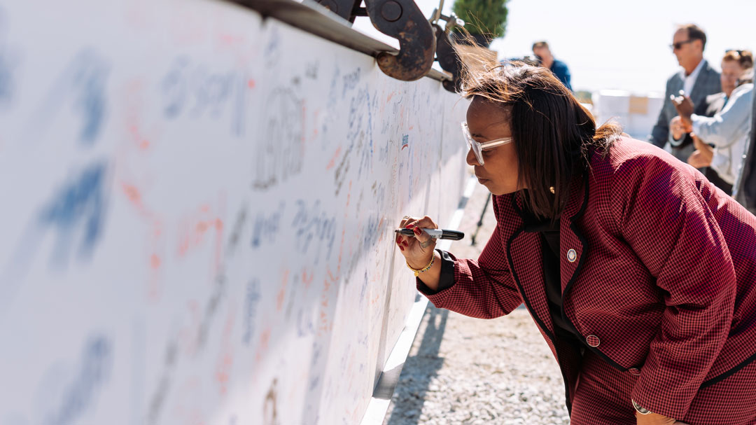 Fort Wayne mayor Sharon Tucker literally signed off on the upcoming 170,000-square-foot addition.