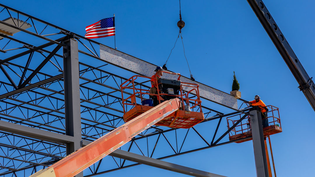 As part of the ceremony, the final steel beam was raised into place.
